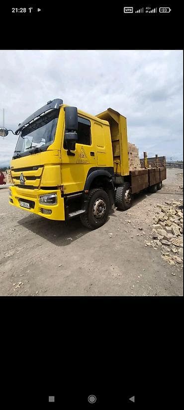 экскаватор w60: Самосвал Howo (CNHTC) 371, желтый. - Колесная формула 6x4. - Мощность — 2