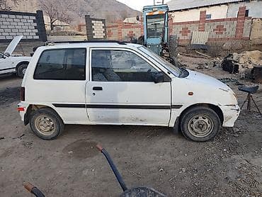 Унаа: Daihatsu Cuore: 1994 г., Кол менен иштөөчү, Бензин, Хетчбек — 5