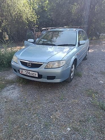 mazda 121: Mazda Familia: 2002 г., 1.5 л, Автомат, Бензин, Универсал — 2