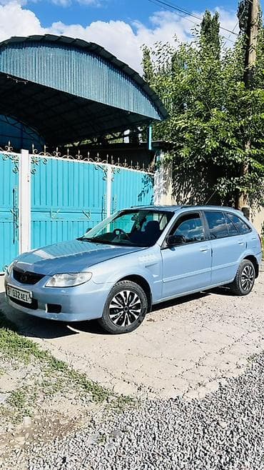Транспорт: Mazda Familia: 2001 г., 1.5 л, Автомат, Бензин, Универсал — 1