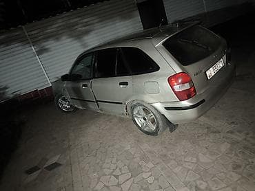 byd e2: Mazda 323: 1999 г., Механика, Бензин, Хэтчбэк — 2
