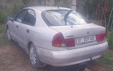 даево матиз 1: Mitsubishi Carisma: 1996 г., 1.8 л, Кол менен иштөөчү, Бензин, Седан — 9