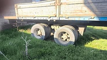Полуприцеп бортовой (площадка) с двухосной тележкой. Характеристики и