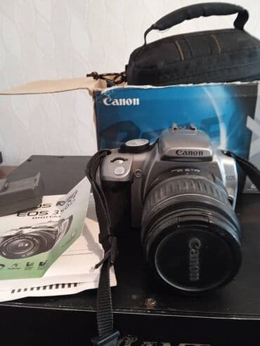 Продаю фотоапарат кенон 350 д чехол зарядка состояние хорошее с