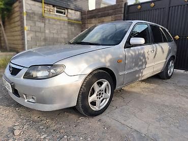 Mazda 323: 2003 г., 2 л, Кол менен иштөөчү, Газ, Хетчбек — 8