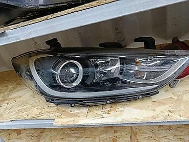 Передняя левая фара Mazda