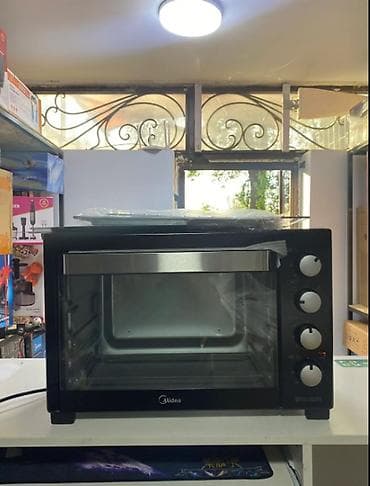 mini refrigerator: Духовка Midea PT40C1, объем 40 л Ключевые особенности: - Настольная — 1