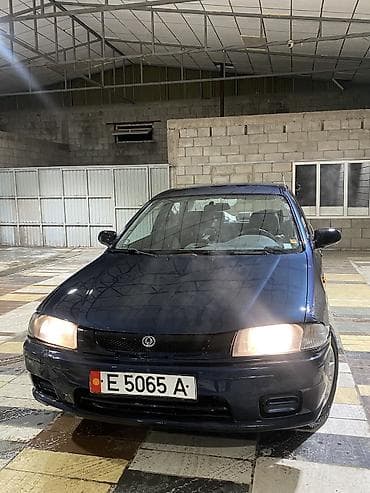 люки крыши: Mazda 323: 1997 г., 1.5 л, Автомат, Бензин, Седан — 7