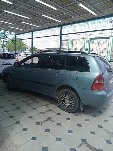 электрик гибрид: Toyota Corolla: 2004 г., Механика, Бензин, Универсал — 1