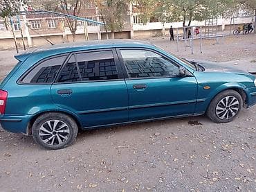 mazda 121: Mazda 323: 1999 г., 1.5 л, Ручные, Бензин, Хэтчбэк — 4