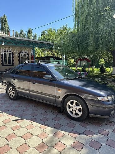 Унаа сатуу: Mazda 626: 1999 г., 1.8 л, Кол менен иштөөчү, Бензин, Седан — 5