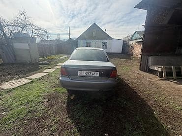 cr v rd5: Mazda Familia: 1995 г., 1.6 л, Механика, Бензин, Седан — 5