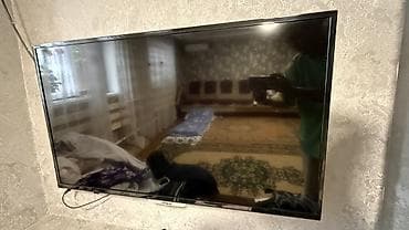 LED‑телевизор VISION, диагональ около 40–43". Тонкая рамка, корпус