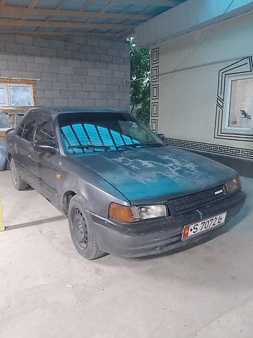 кызыл бирдик: Mazda 323: 1989 г., 1.6 л, Кол менен иштөөчү, Бензин, Седан — 2
