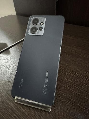 кожаный чехол: Redmi, Redmi 12, Б/у, 128 ГБ, цвет - Черный, 2 SIM — 4