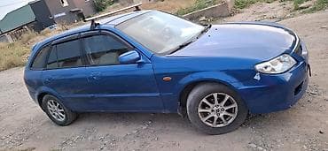 Mazda 323: 2002 г., Механика, Бензин, Хэтчбэк — 3