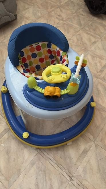 Детские ходунки с игровой панелью - Конструкция на колесиках с