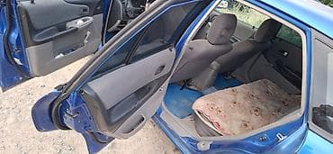 Mazda 323: 2002 г., Механика, Бензин, Хэтчбэк — 7