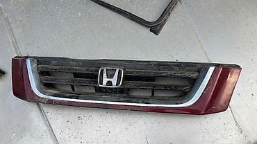 Решётка радиатора Honda с центральной эмблемой «H». - Оригинальная