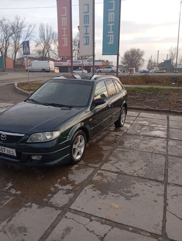 купить держатель номера на авто: Mazda 323: 2003 г., 1.6 л, Механика, Бензин, Хэтчбэк — 1