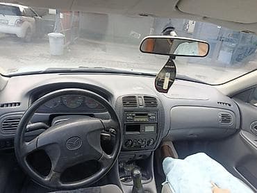 Транспорт: Mazda 323: 2000 г., 1.6 л, Механика, Бензин, Хэтчбэк — 7