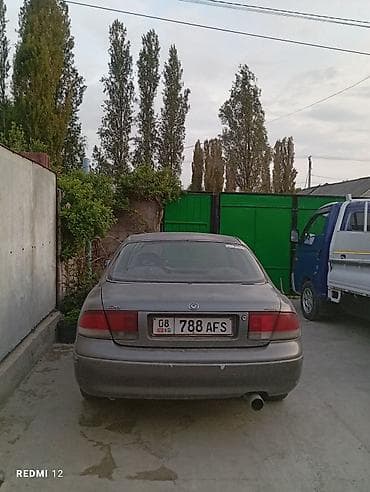 Mazda 626: 1990 г., 2 л, Кол менен иштөөчү, Бензин, Седан — 1