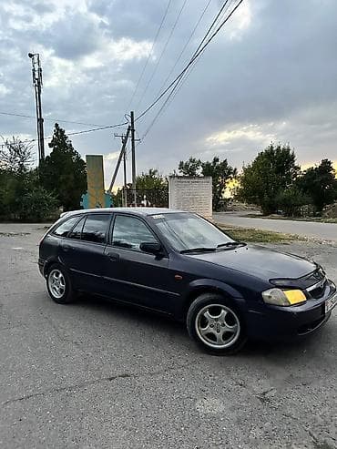 in car: Mazda 323: 1999 г., Бензин, Хэтчбэк — 1