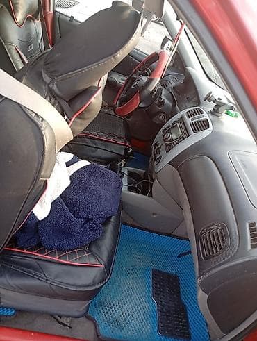 мазда е2000: Mazda 323: 2003 г., Универсал — 4
