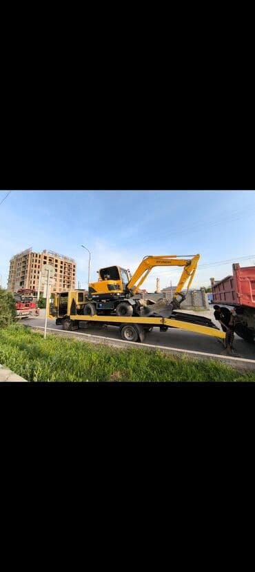 шины на эксковатор: Колесный экскаватор Hyundai, выполненный в характерной для бренда — 6