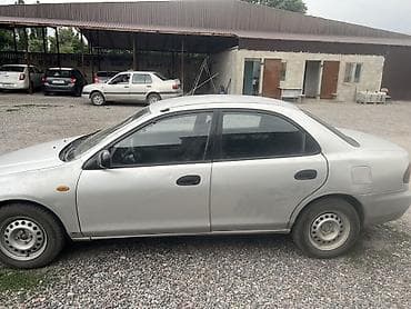електро машина: Mazda 323: 1995 г., Седан — 1