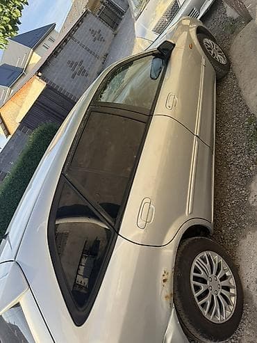 колонка microlab: Mazda 323: 2002 г., 1.6 л, Механика, Бензин, Универсал — 5