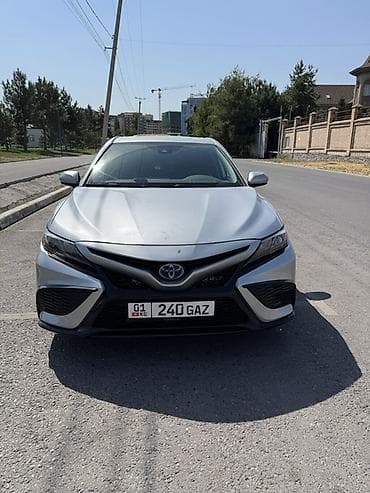 тайота из: Toyota Camry: 2021 г., 2.5 л, Автомат, Гибрид, Седан — 1