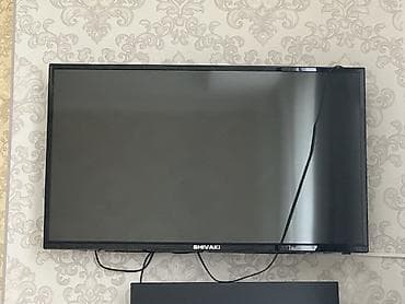 macbook air m1: Телевизор SHIVAKI, диагональ около 32–40". Тонкая рамка, крепление — 1