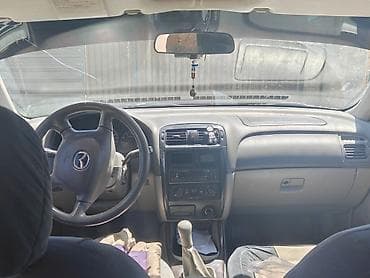Транспорт: Mazda 626: 1999 г., 2 л, Кол менен иштөөчү, Бензин, Седан — 5
