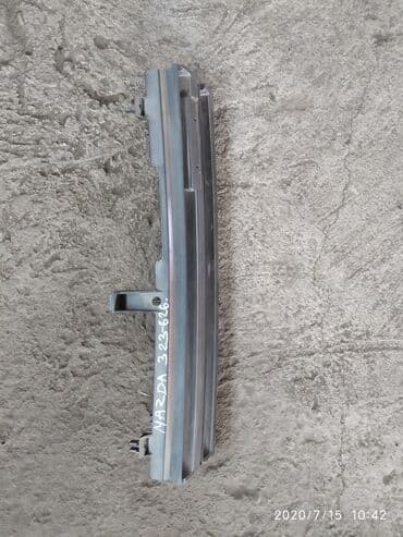 полировычный машынка: Решетка радиатора Mazda Б/у, Оригинал — 1