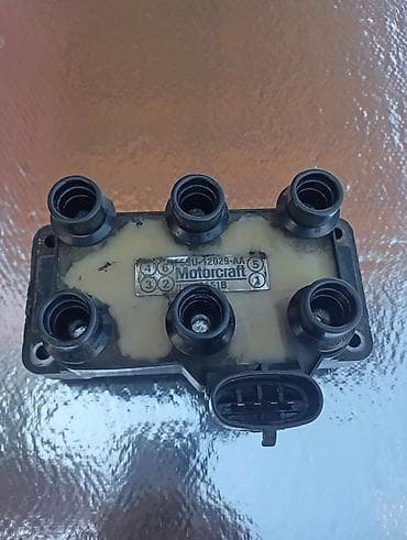 жёсткий сцепка: Катушка зажигания Ford Оригинал — 1