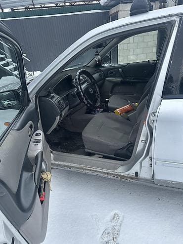 мазда примоси: Mazda 323: 2002 г., 1.3 л, Бензин, Хэтчбэк — 6