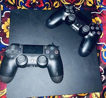 tripp lite: PlayStation 4 Slim (черная) в комплекте с аксессуарами и играми. В — 2