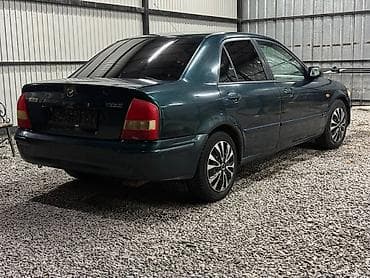 е34 люк: Mazda 323: 2000 г., 1.3 л, Механика, Бензин, Седан — 5