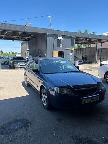Транспорт: Mazda 323: 2002 г., 1.6 л, Механика, Бензин, Хэтчбэк — 9
