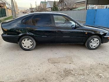 тез арада: Toyota Corolla: 1994 г., Кол менен иштөөчү, Бензин, Лифтбек — 5