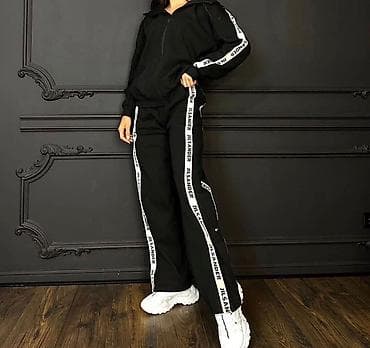 under armor: Женские черные спортивные брюки в стиле трек-пантов с лампасами. - — 1