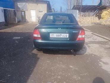 4 5мм: Mazda 323: 2001 г., 1.6 л, Автомат, Бензин, Седан — 4