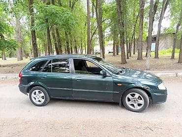 e2 byd: Mazda 323: 2000 г., 1.5 л, Механика, Бензин, Универсал — 4
