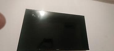 Телевизор VIZIO, диагональ ориентировочно 40–43 дюйма. Плоская панель