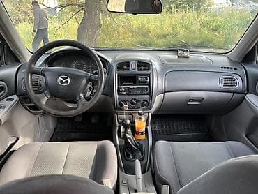 4 5мм: Mazda 323: 2002 г., 1.6 л, Механика, Бензин, Хетчбек — 5