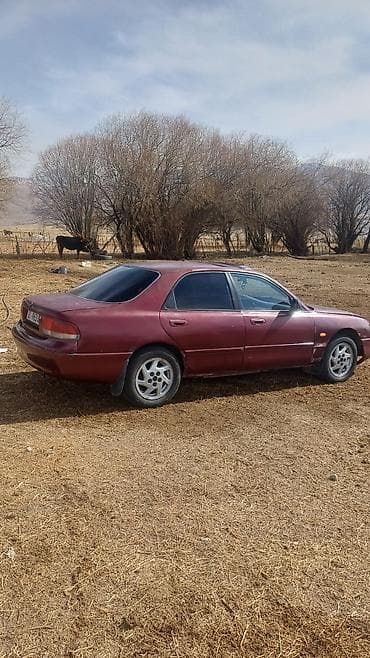 степ 98: Mazda 626: 1992 г., Седан — 2