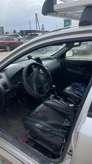mazda x7: Mitsubishi Carisma: 2002 г., 1.6 л, Седан — 5