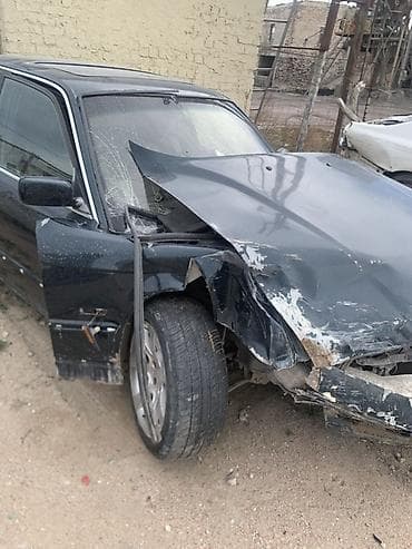 арзан матиз 1: BMW 5‑Series (E34), седан, черный цвет. Автомобиль после сильного — 4