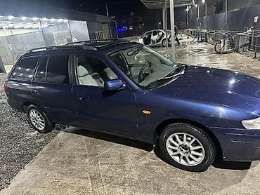 дмрв е34: Mazda Capella: 1999 г., Универсал — 4